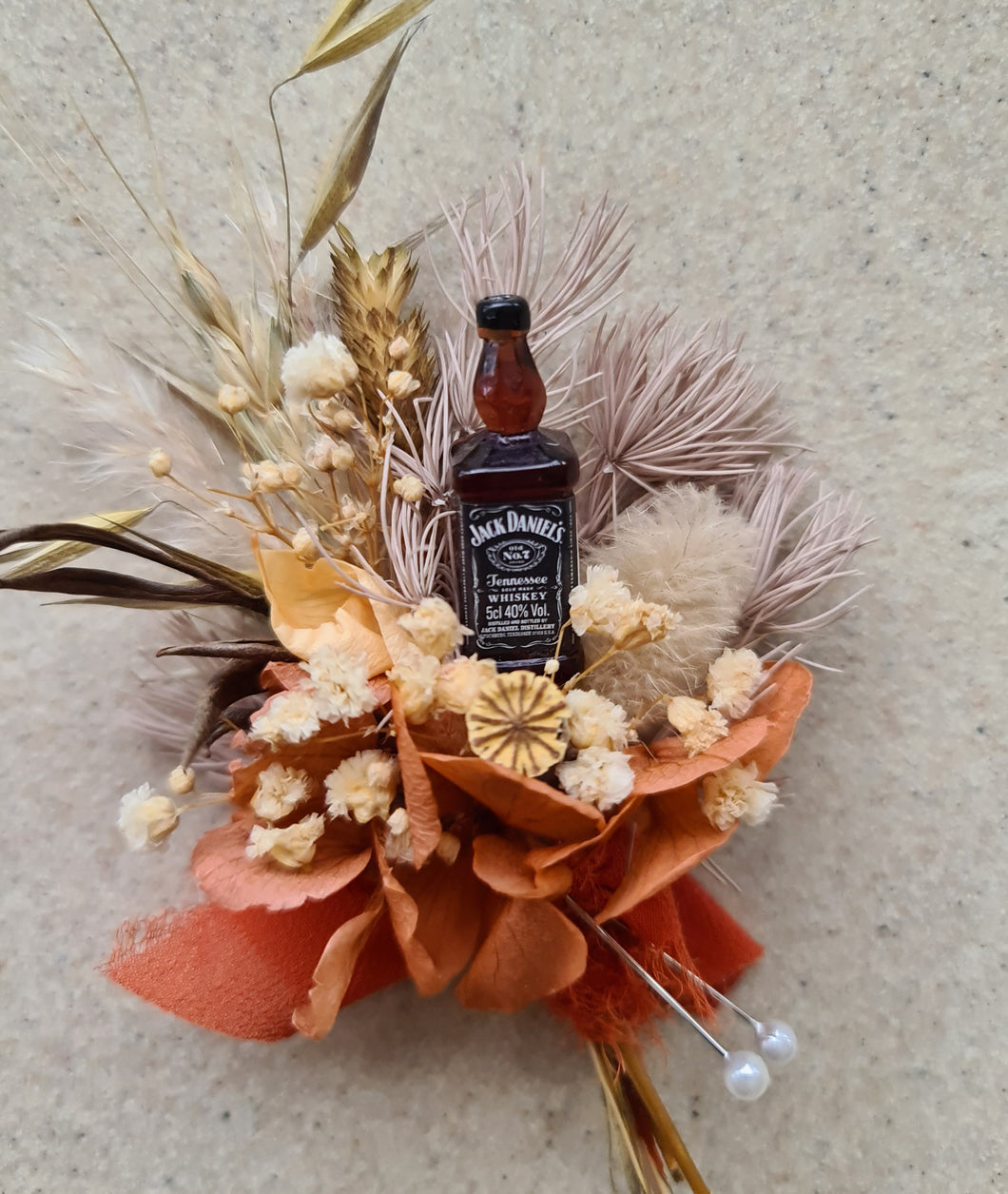 Preserved flowers Rustic style buttonhole with Jack Daniels whiskey bottle