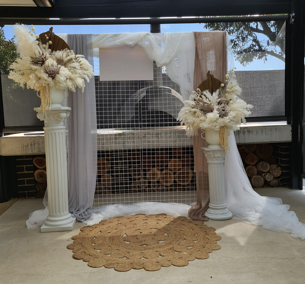 Boho urns & white mesh Roman columns - HIRE ONLY