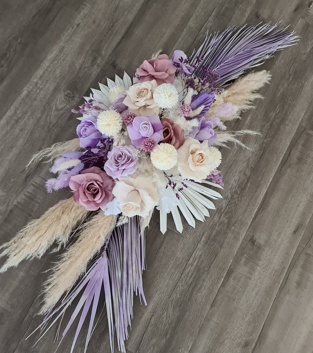 Arbour / backdrop wedding flowers in purple, neutral mauve