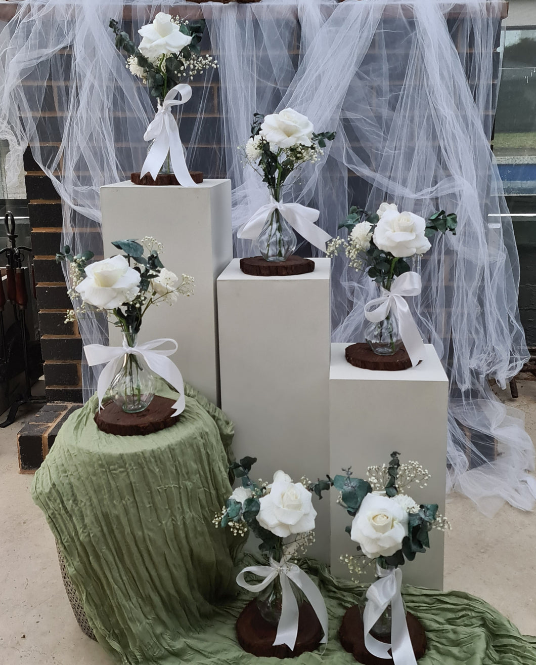 Preserved green eucalyptus and white roses centrepieces