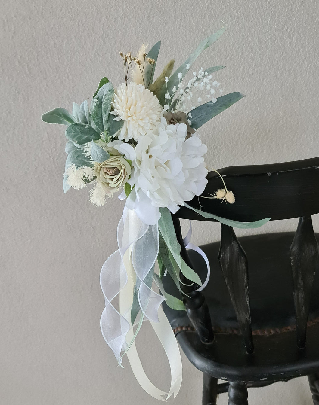 Aisle chair flowers in neutral, green and sage green colours